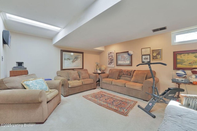 carpeted living room featuring visible vents