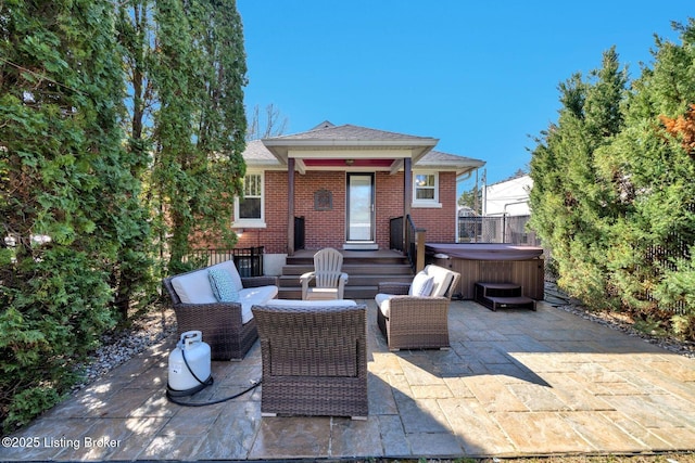 view of patio with a hot tub