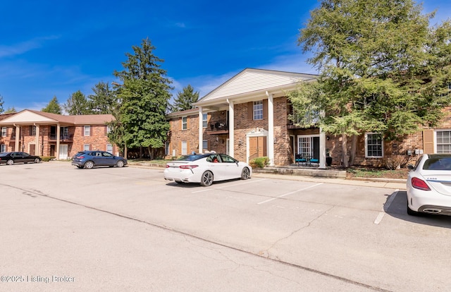 view of property featuring uncovered parking