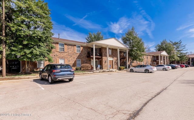 view of property with uncovered parking