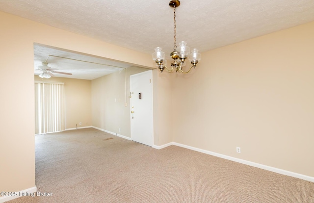 unfurnished room featuring ceiling fan with notable chandelier, light colored carpet, a textured ceiling, and baseboards