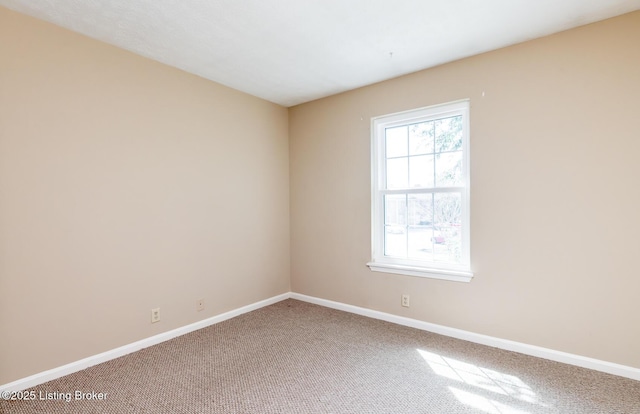 empty room with carpet flooring and baseboards