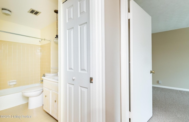 bathroom featuring visible vents, toilet, vanity, and  shower combination