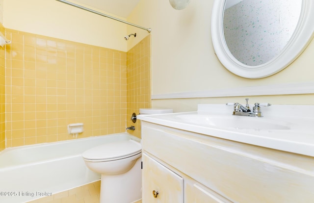 full bathroom with vanity, tile patterned floors, toilet, and shower / washtub combination