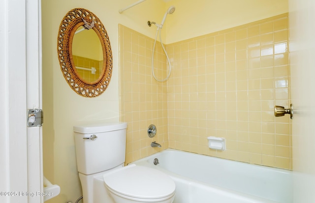 bathroom with bathing tub / shower combination and toilet