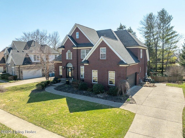 view of front of property featuring brick siding, driveway, a front yard, and roof with shingles