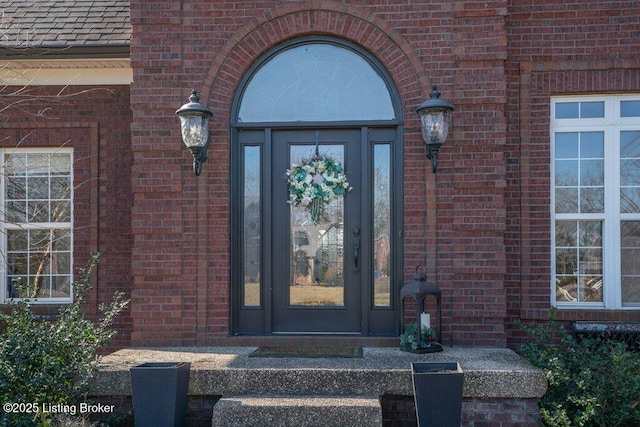 property entrance with brick siding