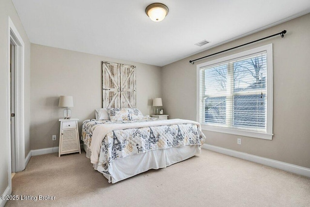 bedroom with visible vents, baseboards, and carpet flooring