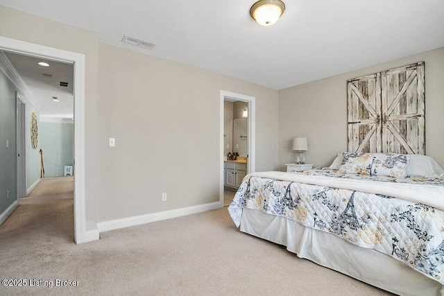 carpeted bedroom featuring visible vents, ensuite bath, and baseboards