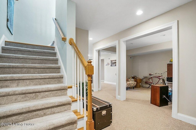 staircase with recessed lighting, baseboards, and carpet floors