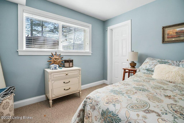 bedroom featuring baseboards and carpet floors