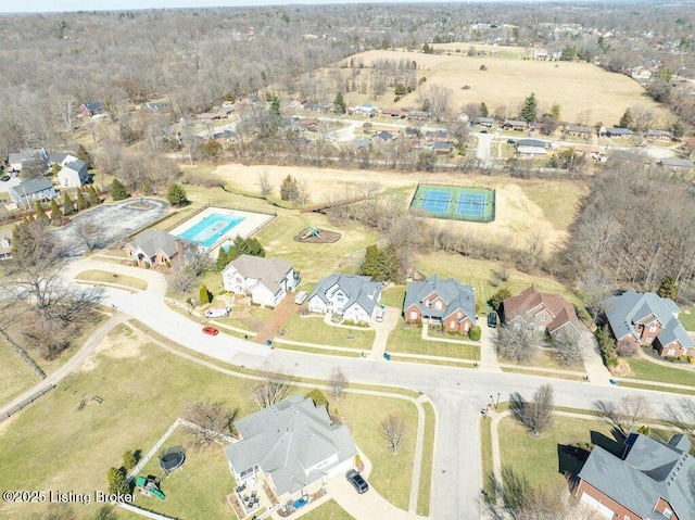 birds eye view of property with a residential view