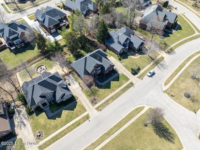 birds eye view of property with a residential view