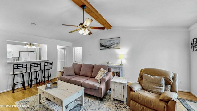 living room with light wood-type flooring, baseboards, vaulted ceiling with beams, and ceiling fan with notable chandelier