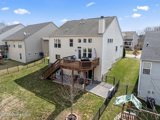 back of property with stairs, a yard, a fenced backyard, a patio area, and a deck