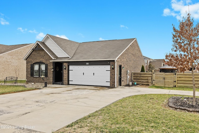 view of front of home featuring concrete driveway, a gate, fence, and brick siding