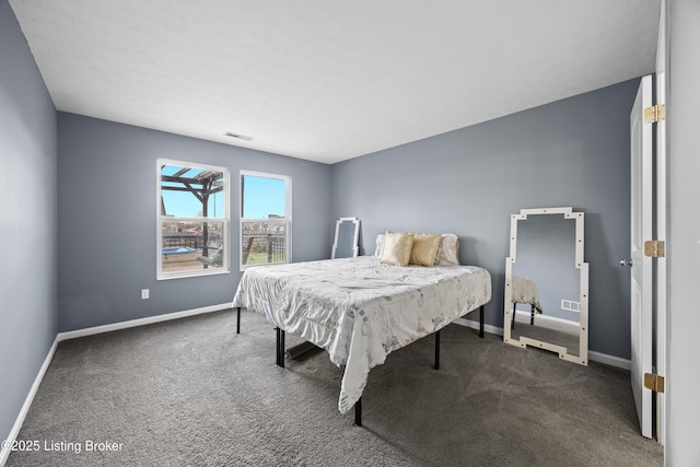 bedroom with carpet and baseboards