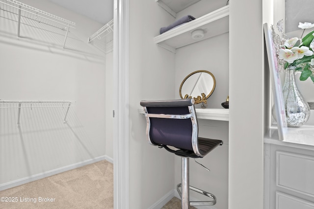 spacious closet with carpet floors