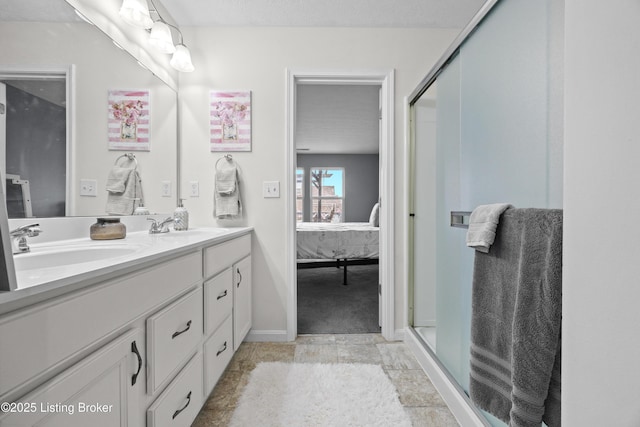 ensuite bathroom with a sink, a stall shower, ensuite bath, and double vanity