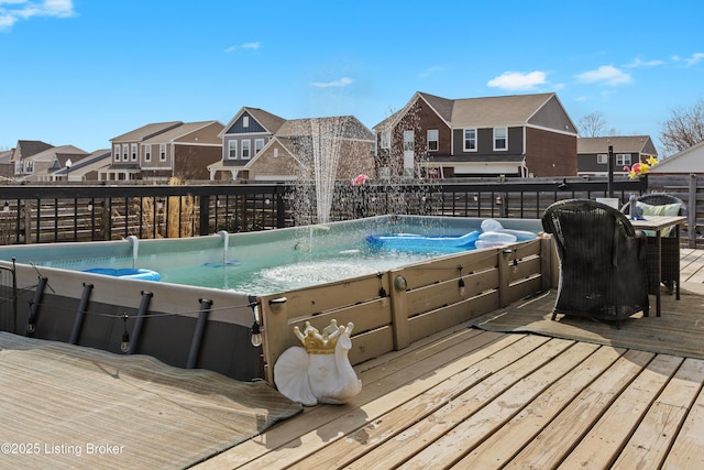 view of pool featuring a residential view