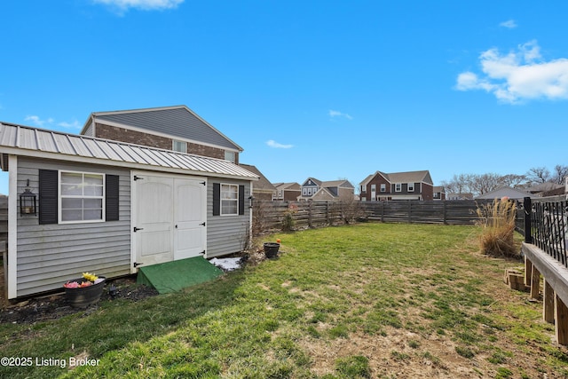 view of yard featuring an outbuilding and a fenced backyard