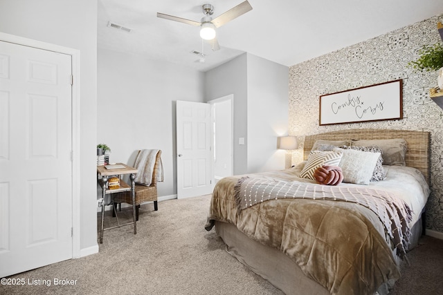 bedroom featuring visible vents, carpet flooring, baseboards, and ceiling fan