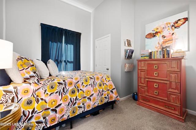 bedroom with baseboards and carpet floors