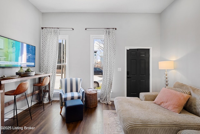 interior space featuring baseboards and wood finished floors