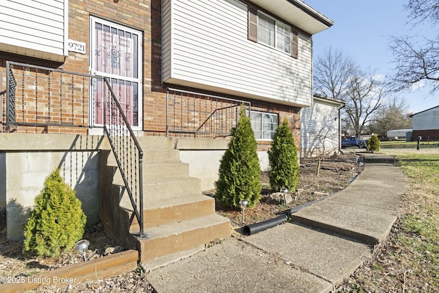 view of home's exterior featuring brick siding