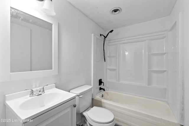 bathroom with vanity, toilet, and bathtub / shower combination