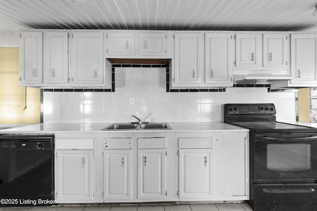 kitchen featuring black appliances, under cabinet range hood, a sink, tasteful backsplash, and white cabinets