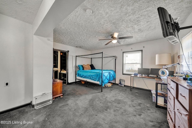 carpeted bedroom featuring baseboards, a textured ceiling, and ceiling fan