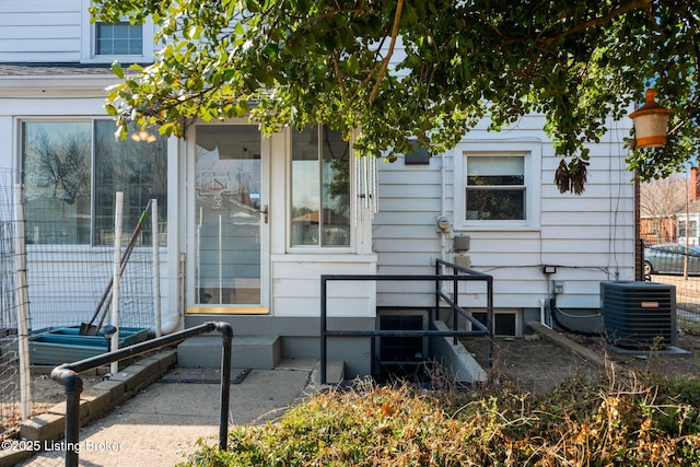 property entrance featuring central AC unit