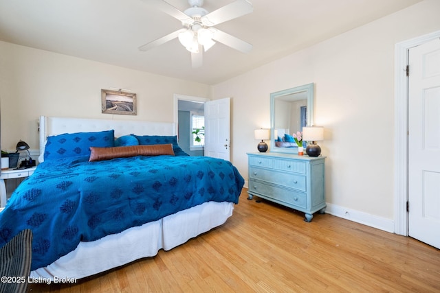 bedroom with light wood-type flooring, baseboards, and ceiling fan