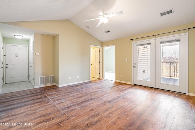 unfurnished room with wood finished floors, visible vents, and ceiling fan