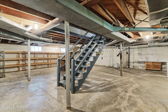 basement featuring stairs