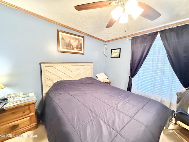 bedroom with a textured ceiling, crown molding, and ceiling fan