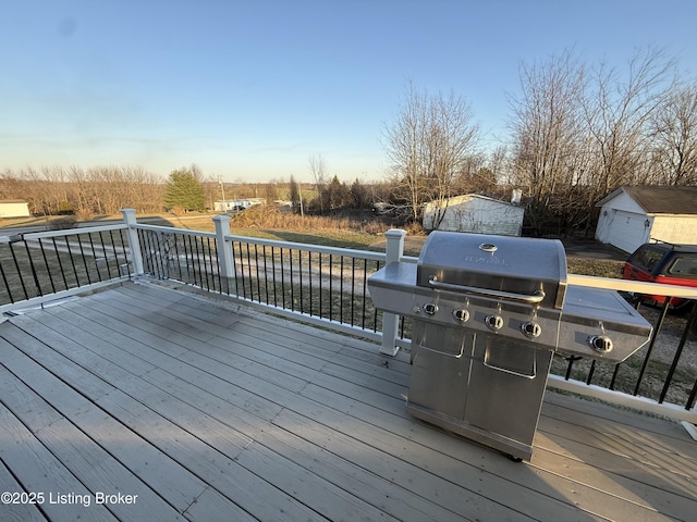 wooden deck with a grill