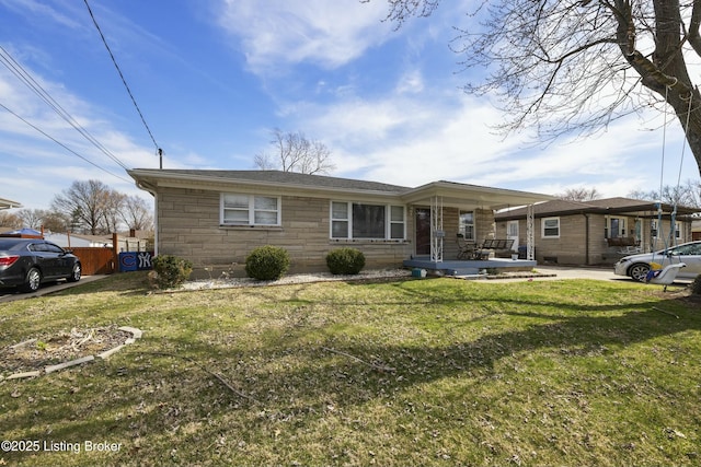 view of front of property with stone siding and a front yard