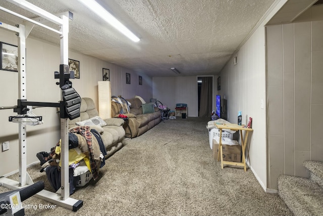 exercise area with a textured ceiling and carpet