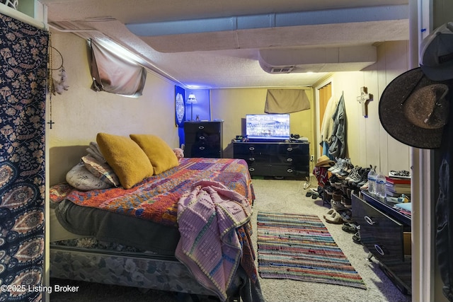 bedroom with visible vents and carpet