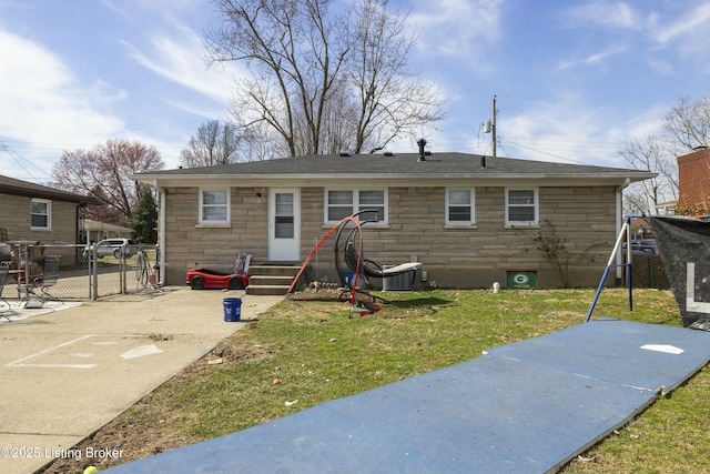 back of house with stone siding, entry steps, a patio, and a gate