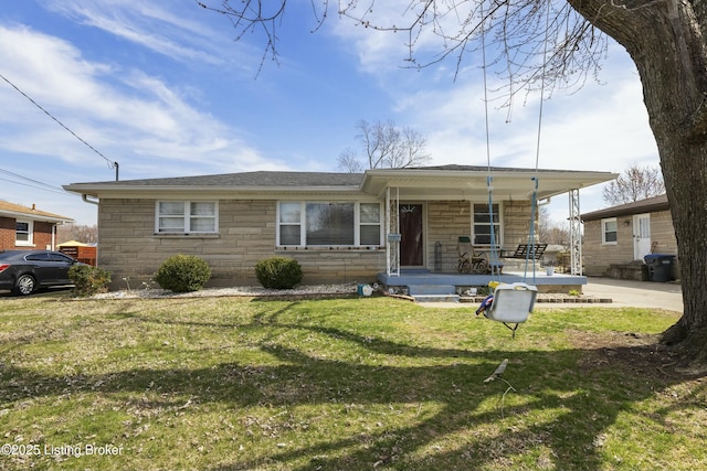 view of front of home featuring a front yard, a porch, and stone siding