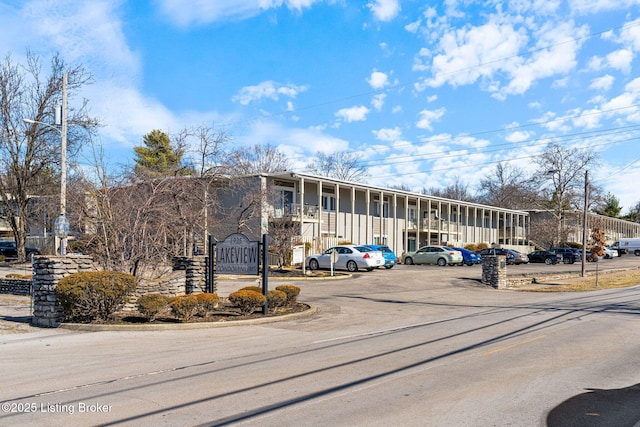 view of property with uncovered parking