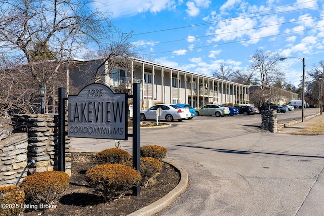 community sign with uncovered parking