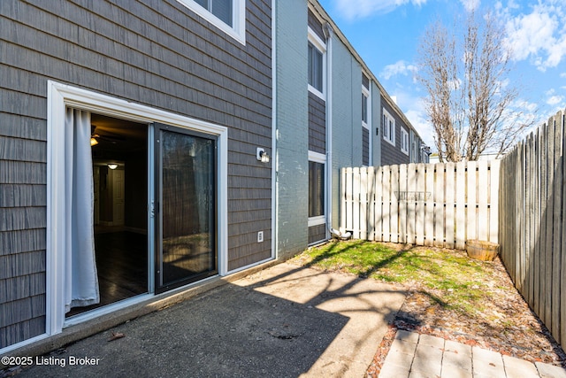 view of patio featuring fence