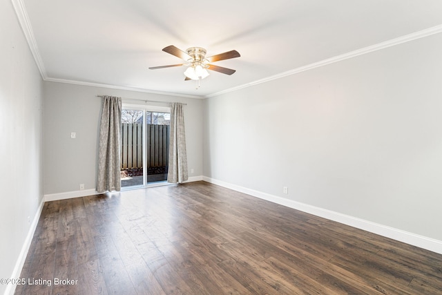 empty room featuring ornamental molding, ceiling fan, baseboards, and dark wood-style flooring