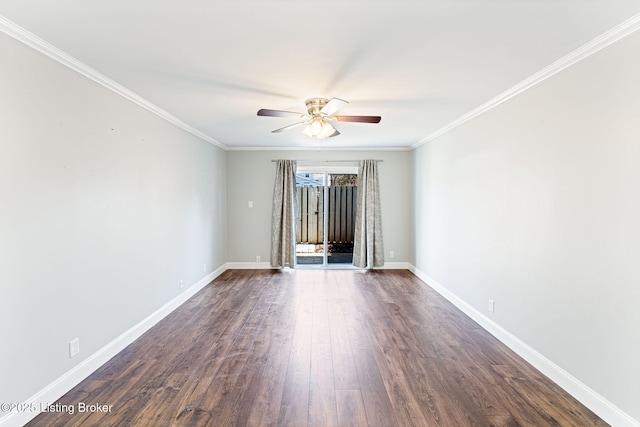 spare room featuring baseboards, dark wood-style floors, and ornamental molding