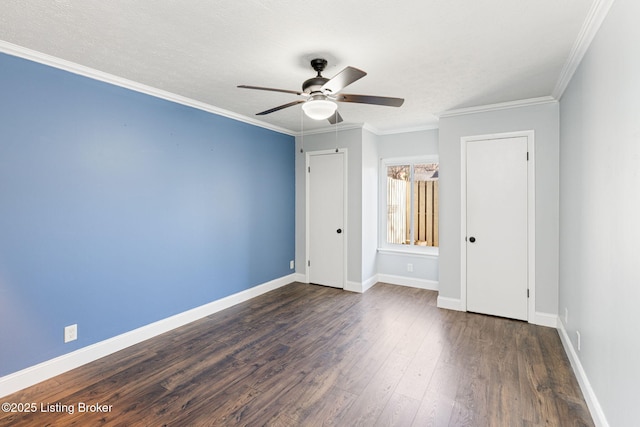 unfurnished bedroom featuring a textured ceiling, dark wood finished floors, crown molding, baseboards, and ceiling fan