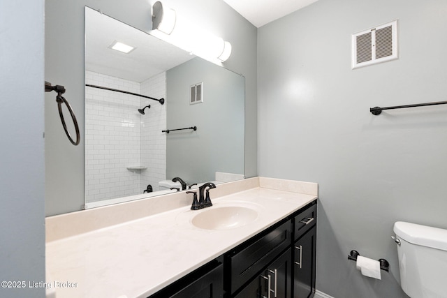 full bath featuring visible vents, toilet, vanity, and walk in shower